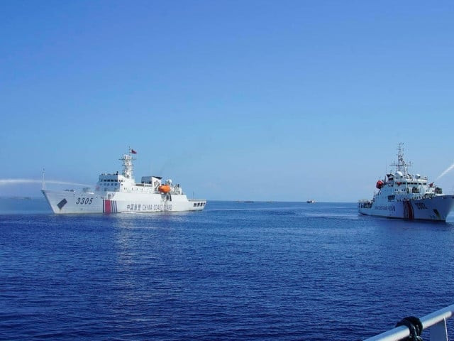 chinese coast guard ships spray water cannons during an encounter with a philippine government boat on its way to the scarborough shoal in the south china sea on december 9 2023 photo new york times